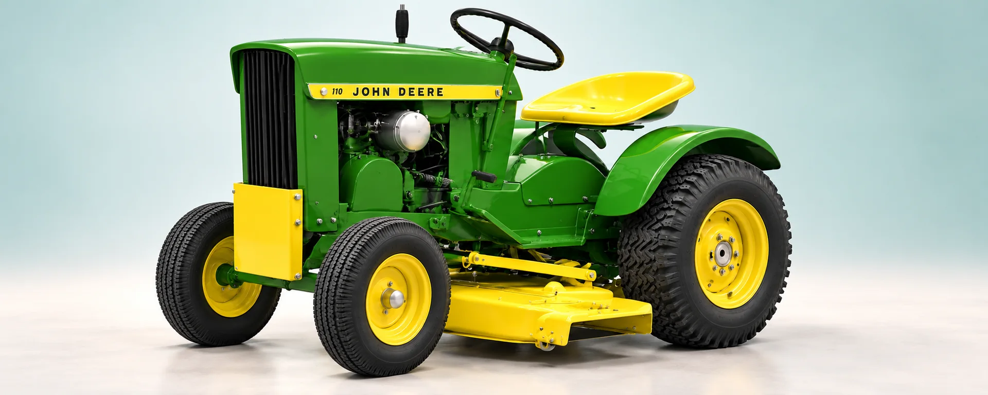 John Deere 110 — Early round-fender configuration with mower deck